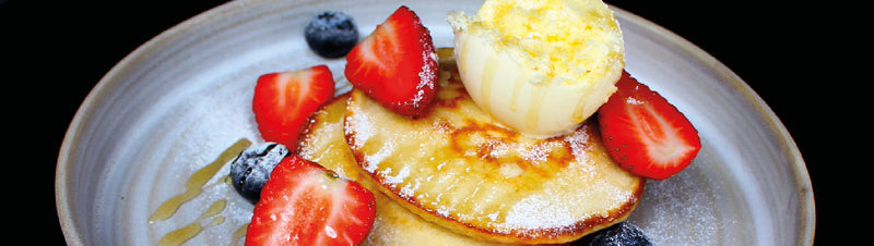 Perfect Buttermilk Pancakes with clotted cream, summer berries and honey